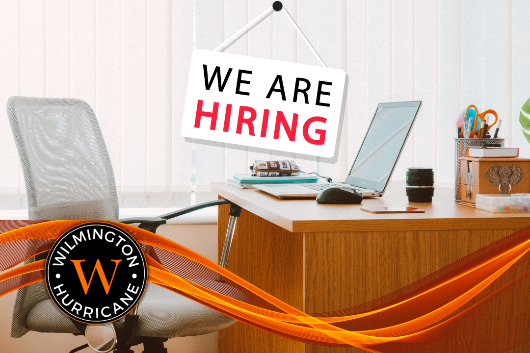 Office desk, logo, "We are hiring"